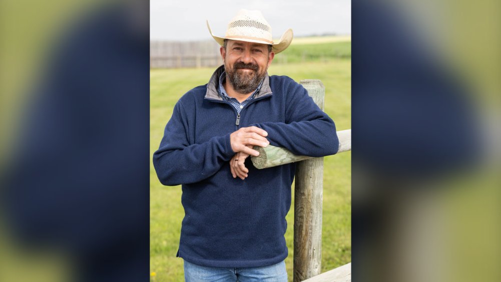 Gavin Vermette leaning on a fence at Dun Rite Stock and Stables